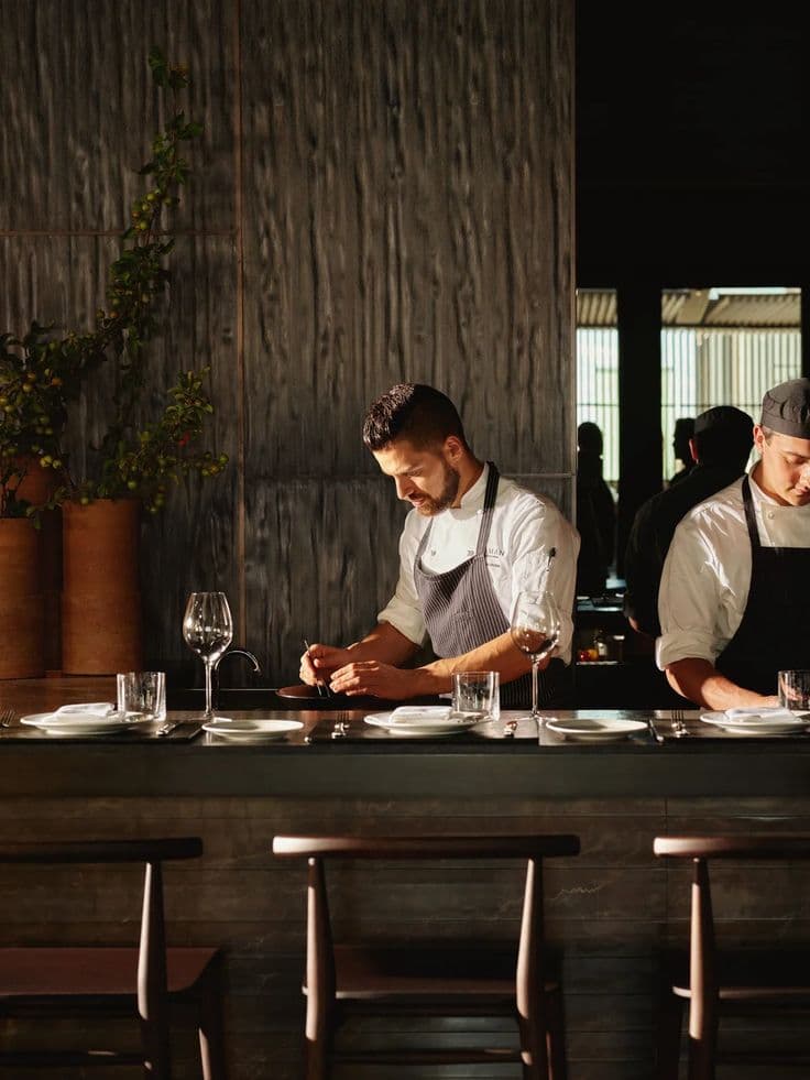 Head chef and kitchen team working in a professional kitchen at a Perth restaurant